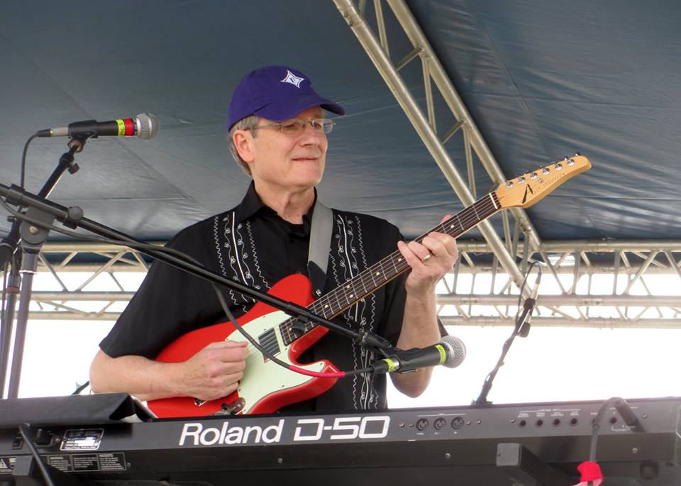 Fred playing guitar